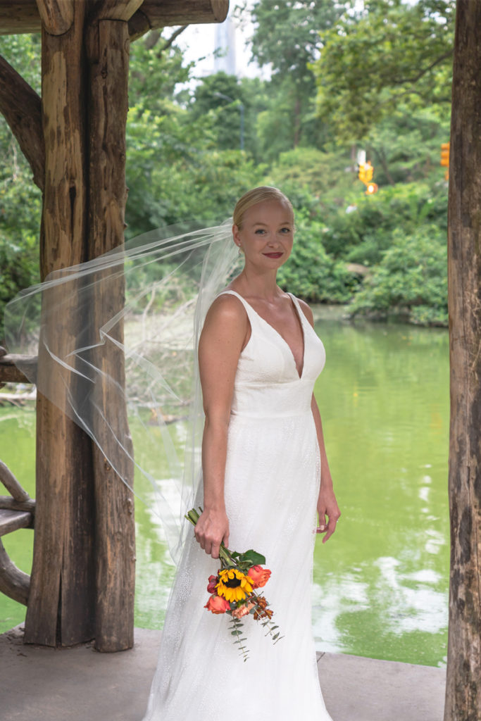 Wedding portrait of Kat Gaffney under the pavilion of Wagner Cove.