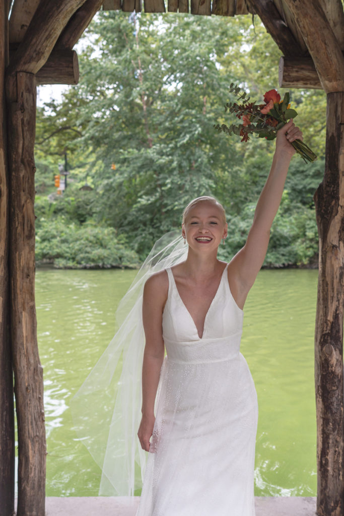 A happy Kat Gaffney smiles for the camera under the pavilion of Wagner Cove.