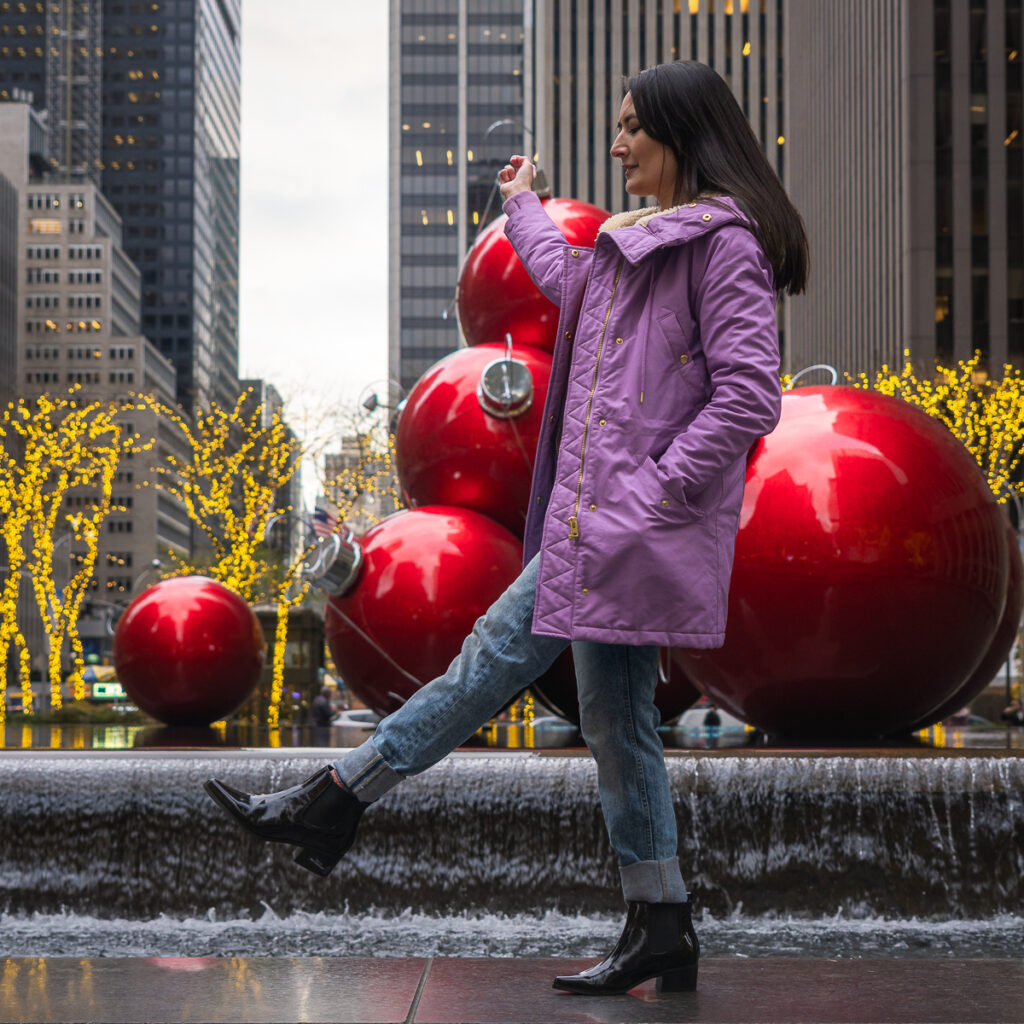 6th Ave in Midtown, otherwise known as Avenue of the Americas, has a lot of Christmas lights in NYC.