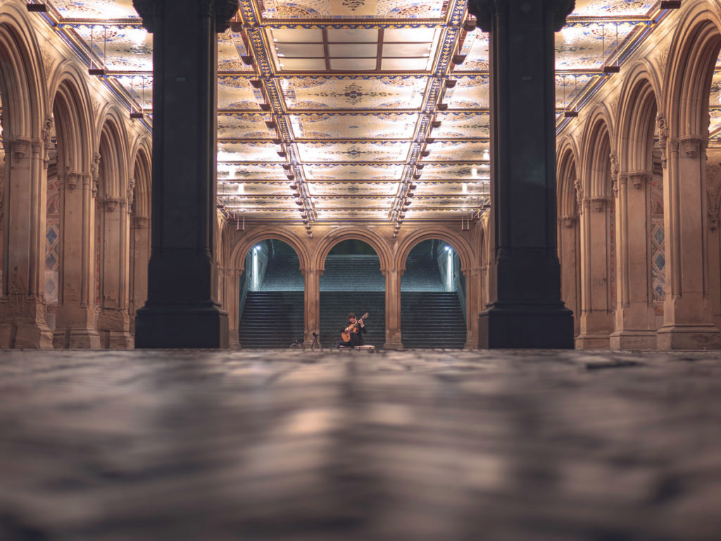 Bethesda Terrace is one of the best Central Park photo spots to photograph performances.