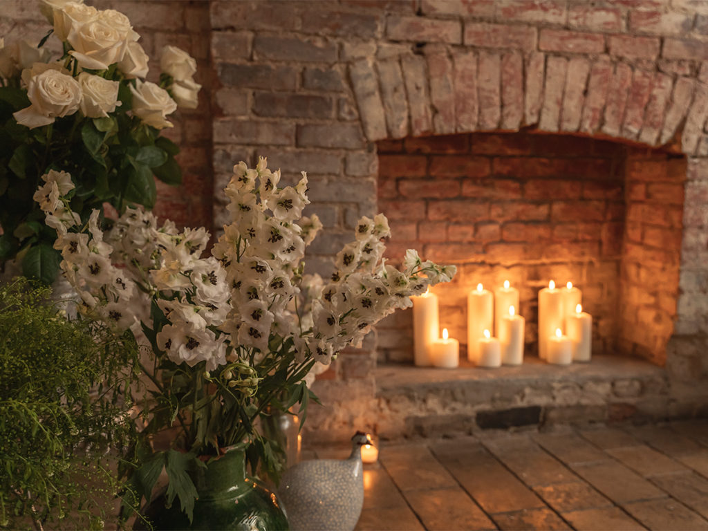 Flowers and candles adorned the private room for a proposal at Palma restaurant NYC.