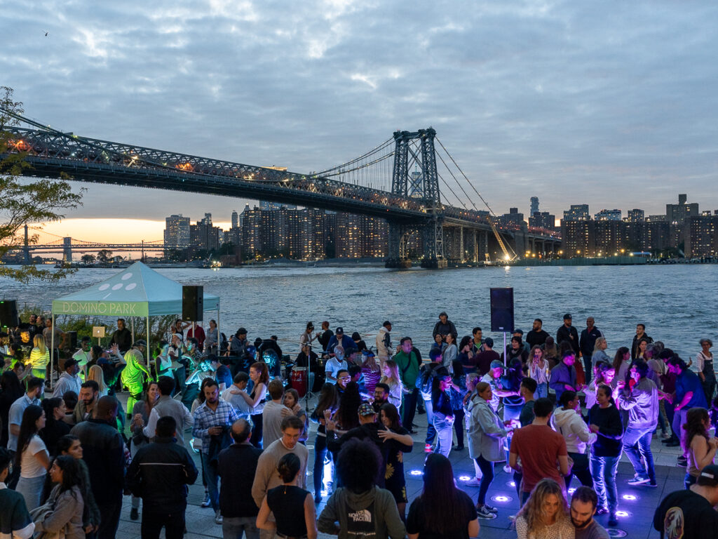 Domino Park is a great Brooklyn photography spot and hosts free events such as Salsa by the Water every Wednesday in September.