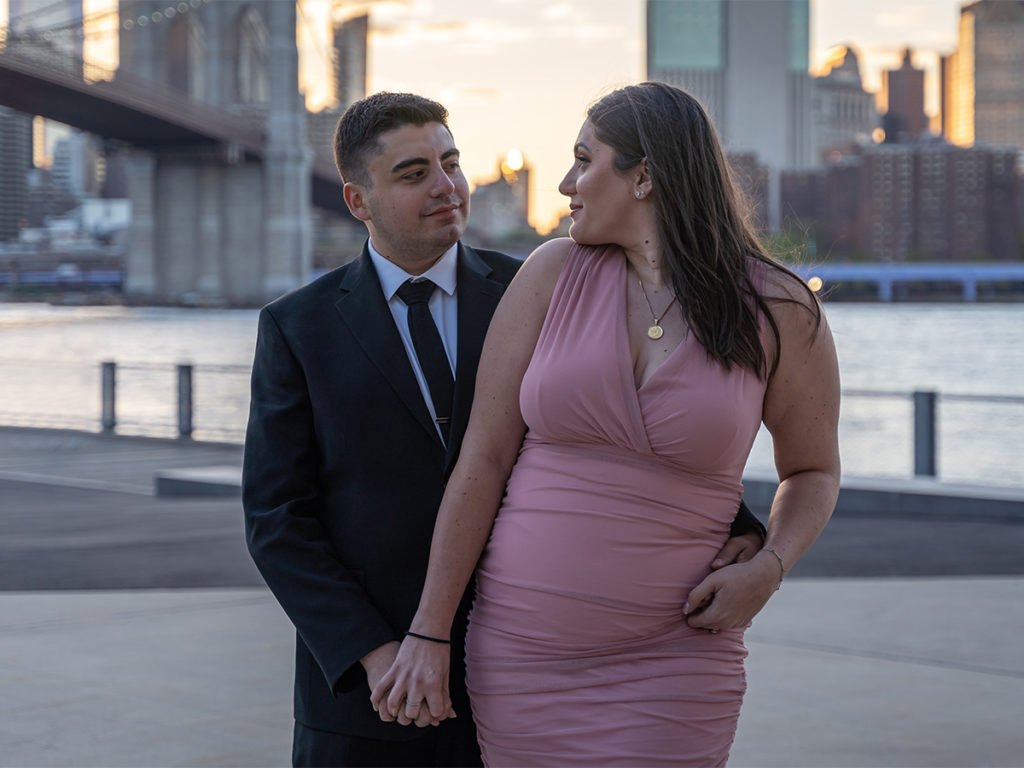 Couple's portrait during sunset at Jane's Carousel Brooklyn.