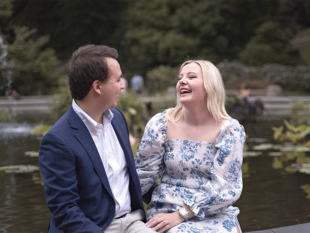 Couple looks at each other happily for their engagement photoshoot after their Central Park proposal.