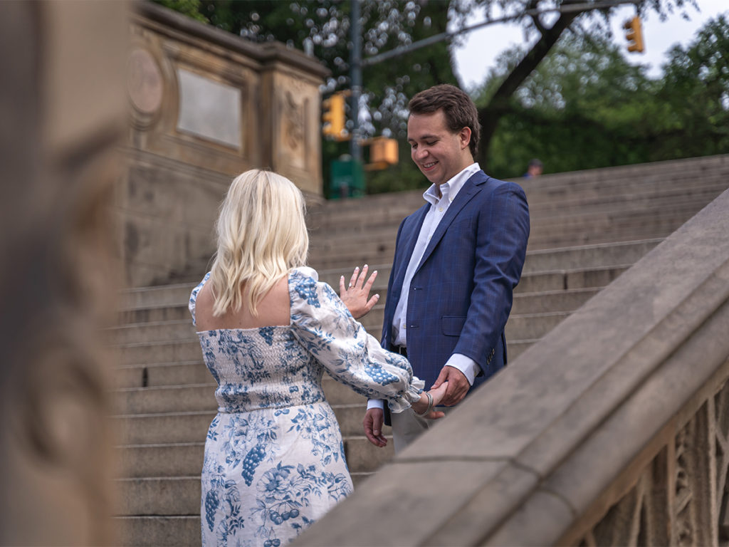 Emily Hamilton looks at her engagement ring after their Central Park proposal.