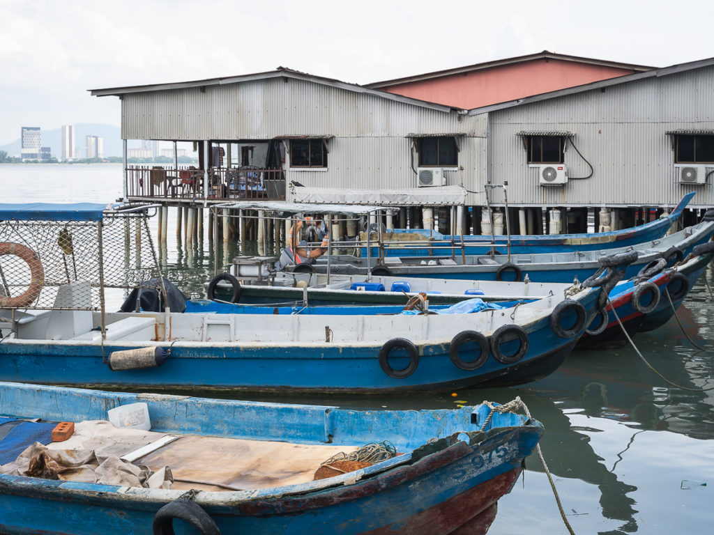 The Clan Jetties of Penang are historic villages built over the water and are a cool place to check out in Penang during a Malaysia 2 week itinerary.