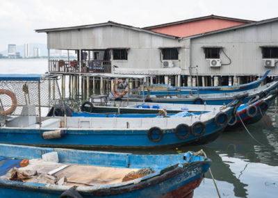 The Clan Jetties of Penang are historic villages built over the water and are a cool place to check out in Penang during a Malaysia 2 week itinerary.