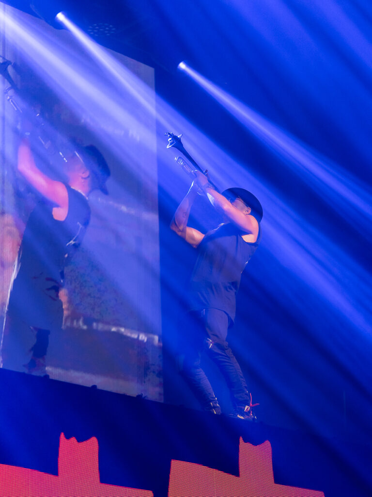 Timmy Trumpet performing on stage before Steve Aoki for his own concert photography moment.