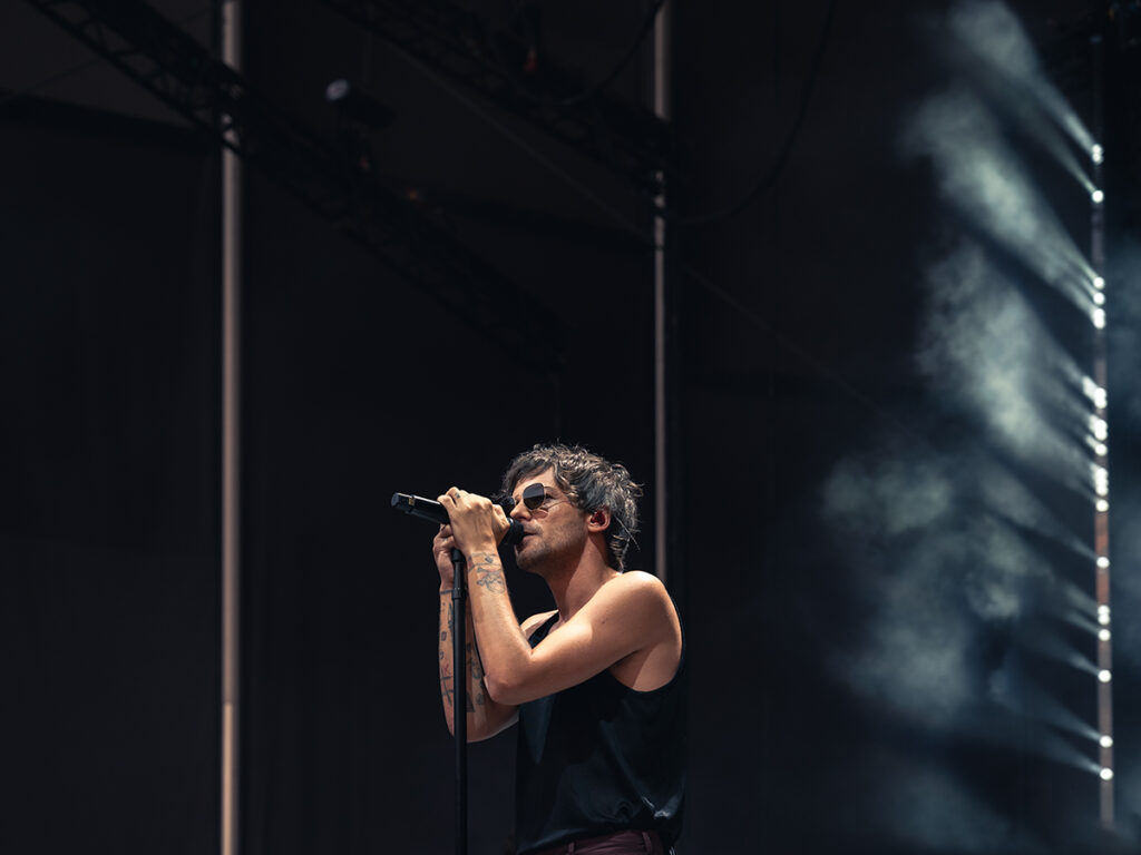 Louis Tomlinson sings at his concert in Forest Hills Stadium in Queens, NY.