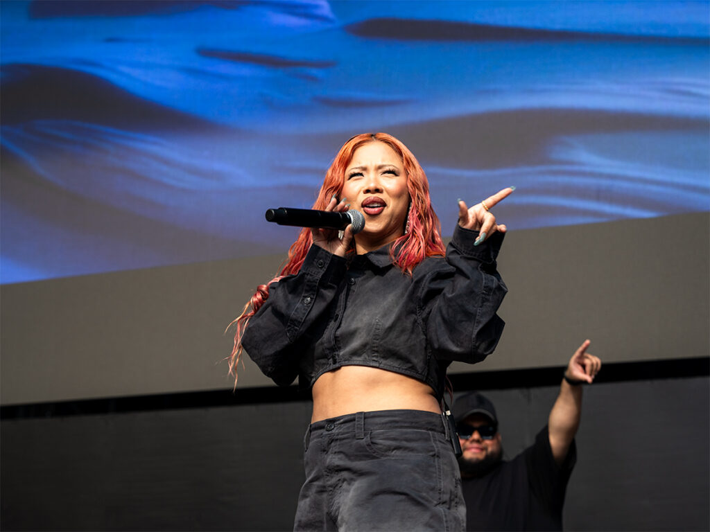 Thuy points at the audience at Head In The Clouds Festival NY.