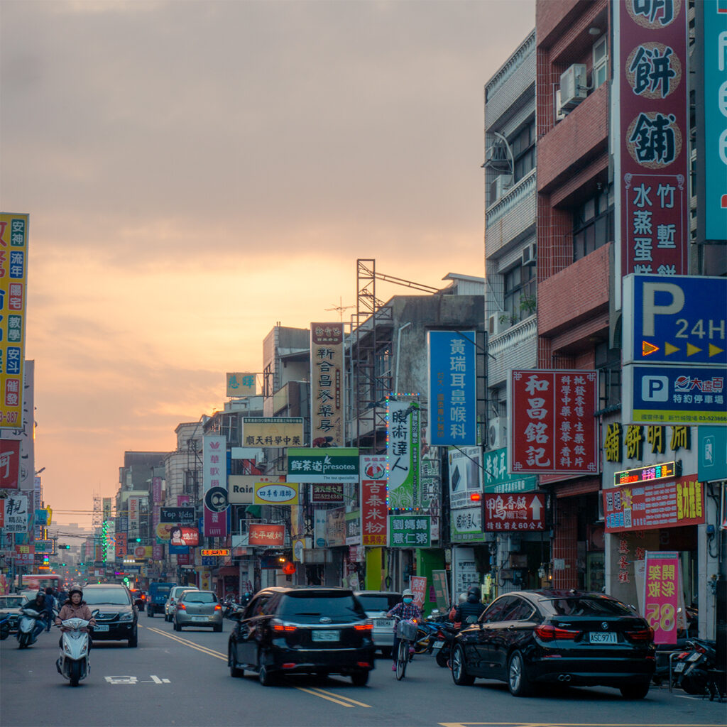 Mopeds and cars on the busy streets of Hsinchu City.