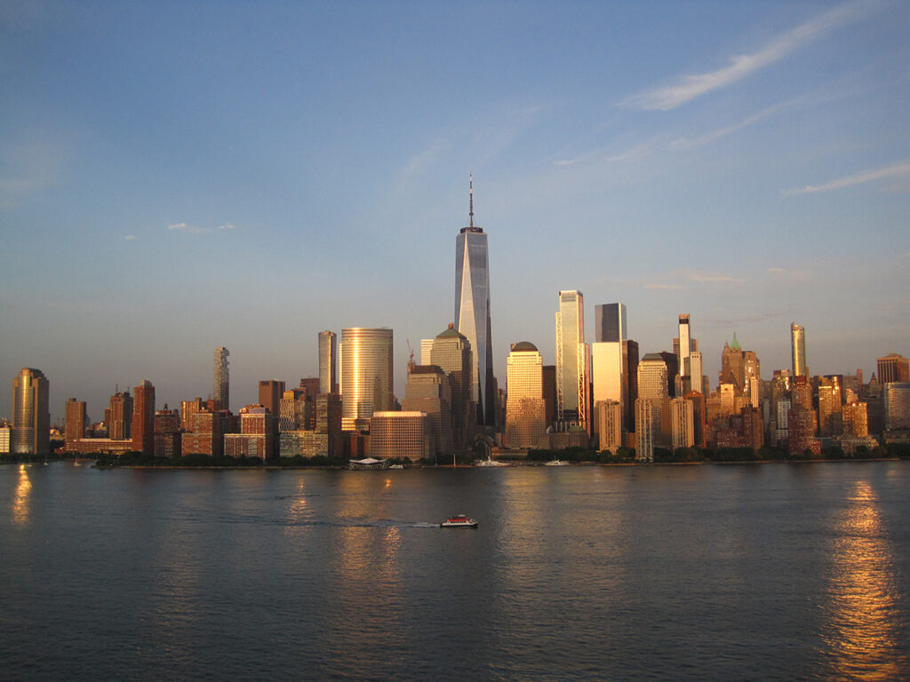 The Lower Manhattan skyline at golden hour photographed with a Canon vintage camera.