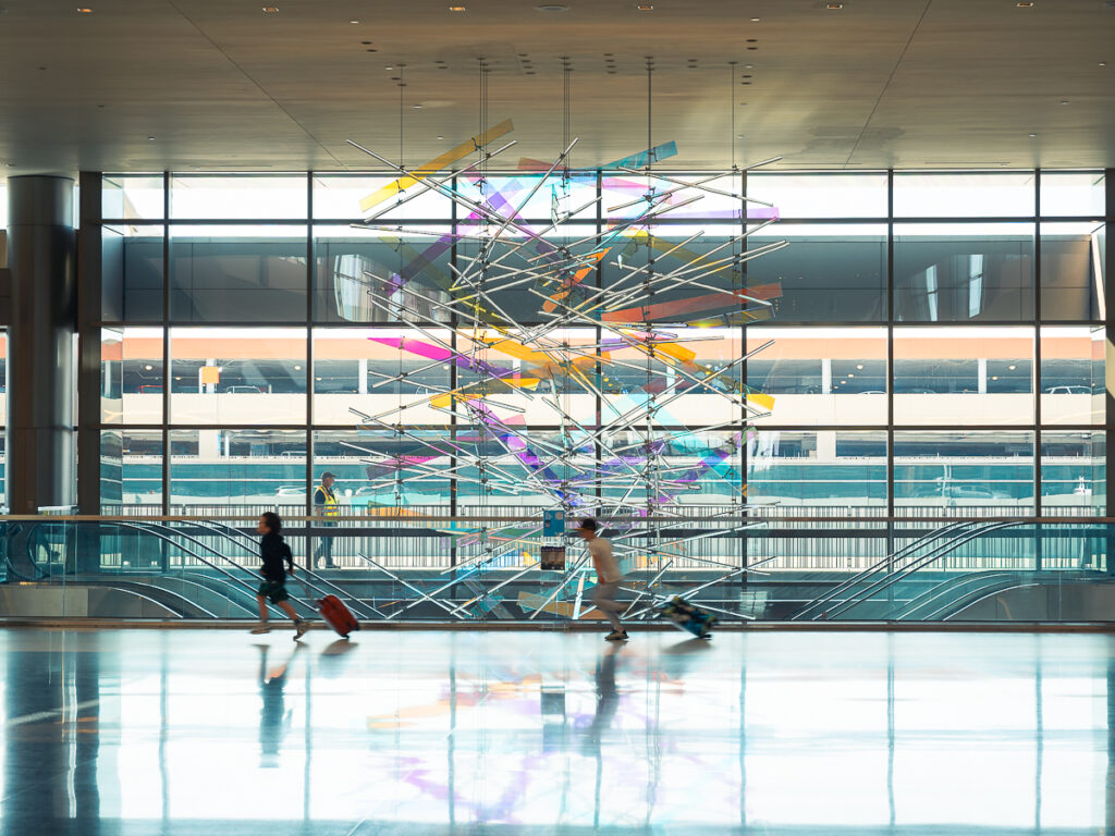 Motion blur of kids running with their suitcases inside the Salt Lake City Airport.