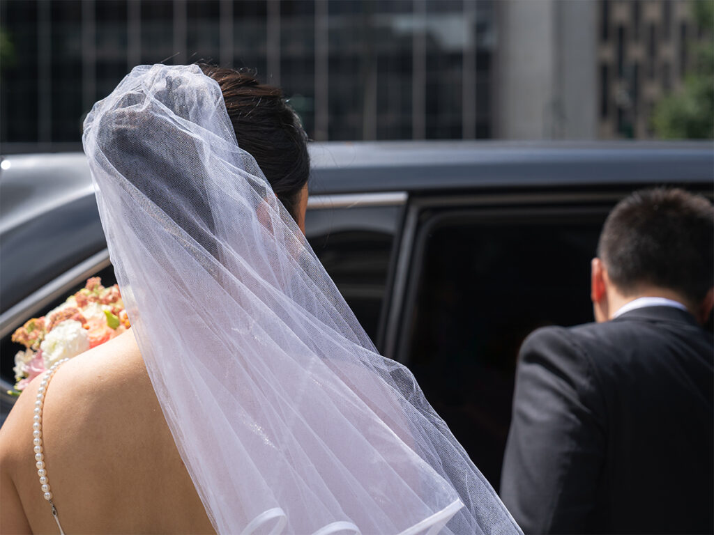 The newly wedded couple get into an Uber after their City Hall Elopement.