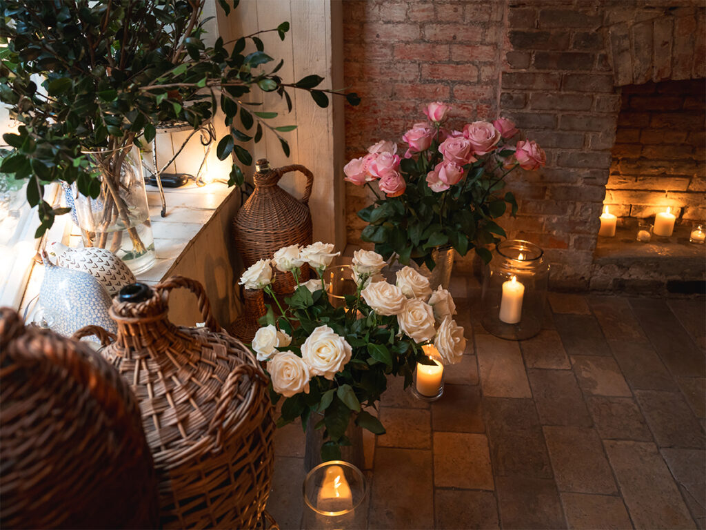 West Village Proposal Photographer at Palma NYC set up with romantic flowers and candles.