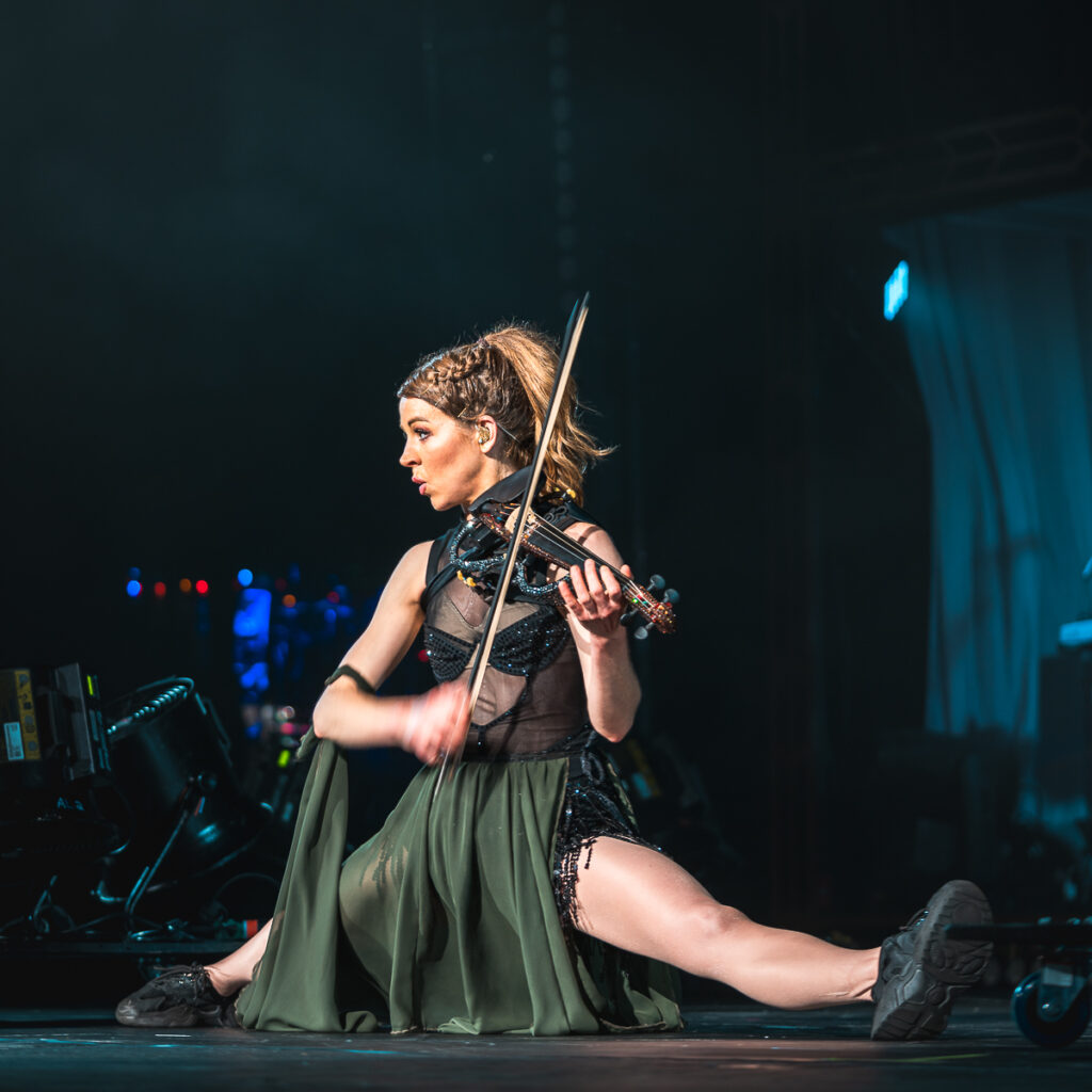 Lindsey Stirling is an unparalleled performer as exemplified playing the violin with going into a split on stage at Radio City Music Hall.