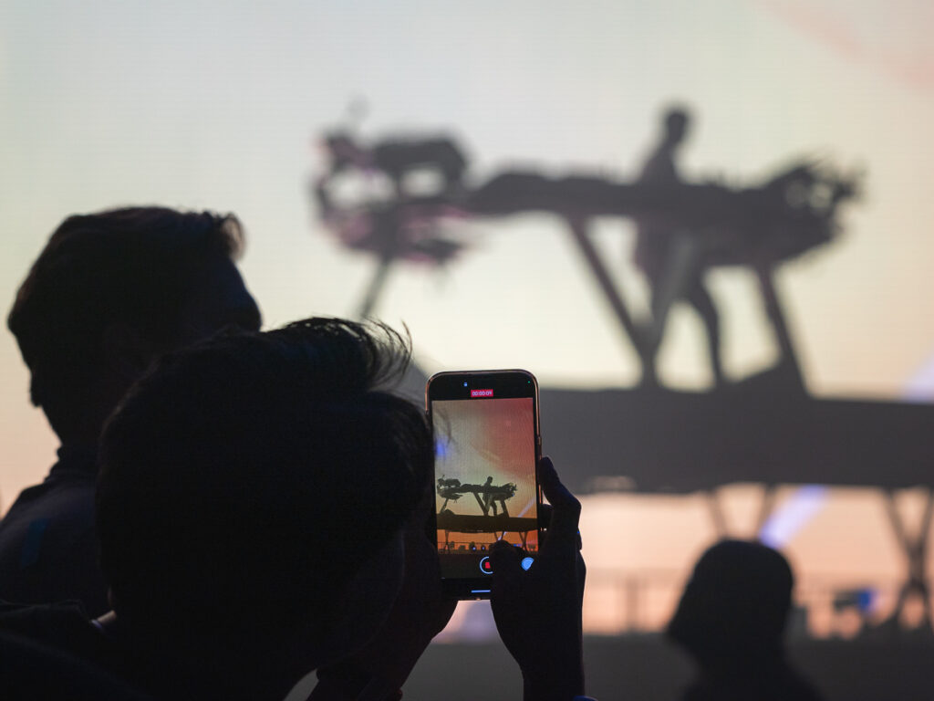 A fan records Kygo on his iPhone at Barclays Center.