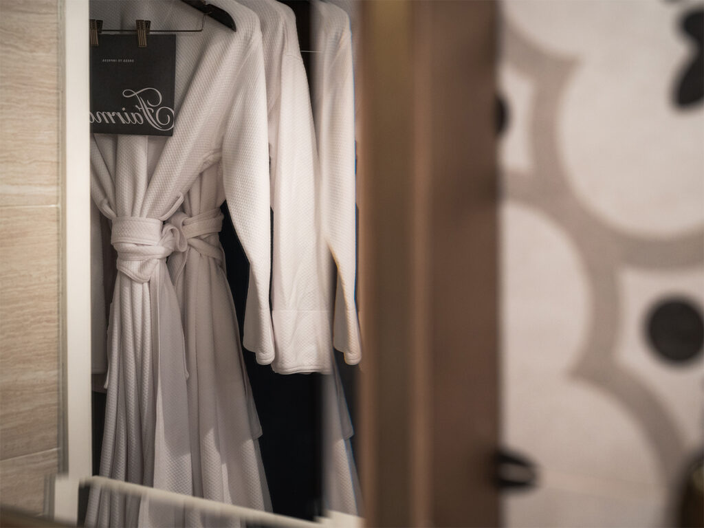 Mirror shot of a robe in the bathroom at Fairmont el San Juan.