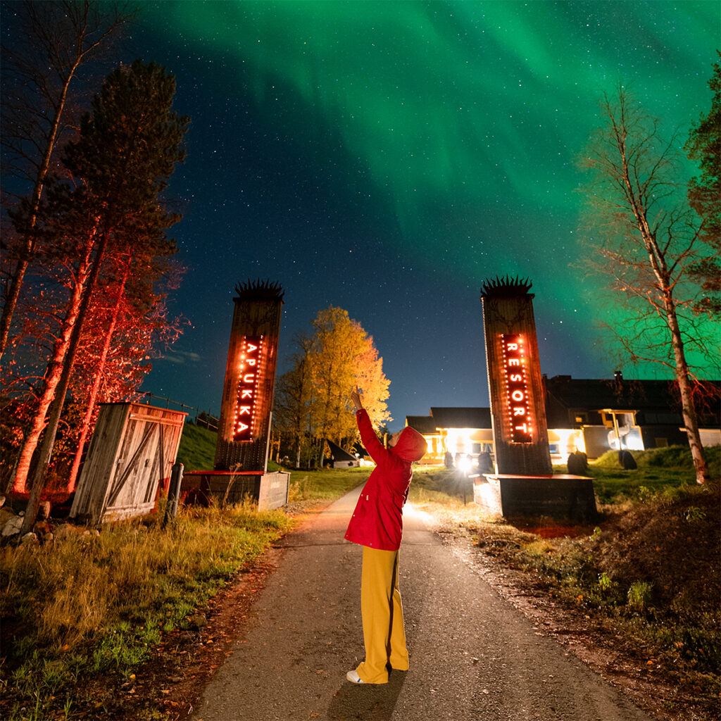 Photographing the Northern Lights over Apukka Resort in Rovaniemi, Finland.