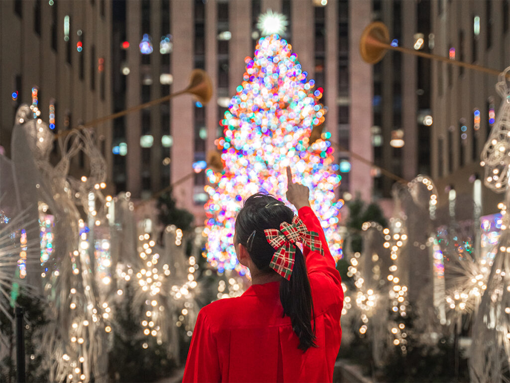 Standing in front of the Rockefeller Center Christmas Tree.