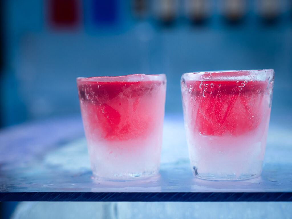 Enjoy cocktails in cups made from ice at the Arctic SnowHotel & Glass Igloos, a place where to stay in Rovaniemi, Finland.