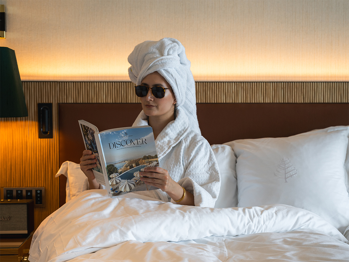 Travel photographer and content creator wrapped up in a towel at the Four Seasons Hotel Ritz Lisbon.