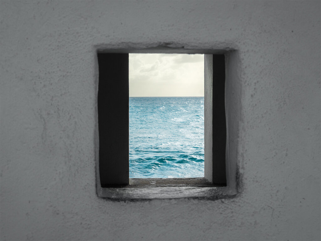 Window of a slave hut on Bonaire is a must-see during Dutch Caribbean solo travel island tours to history.