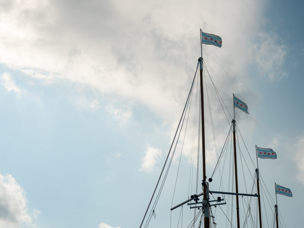 The Chicago state flag flies high on boats at Navy Pier.