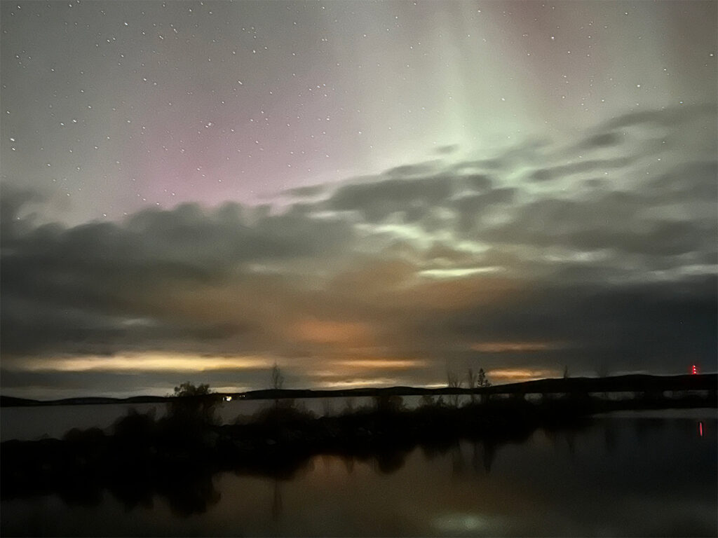 Image of photographing the Northern Lights with an iPhone.