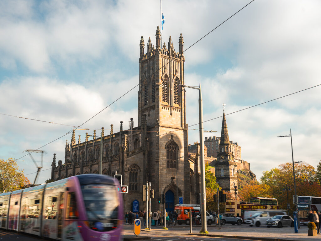 Edinburgh with a light rail crossing in front.