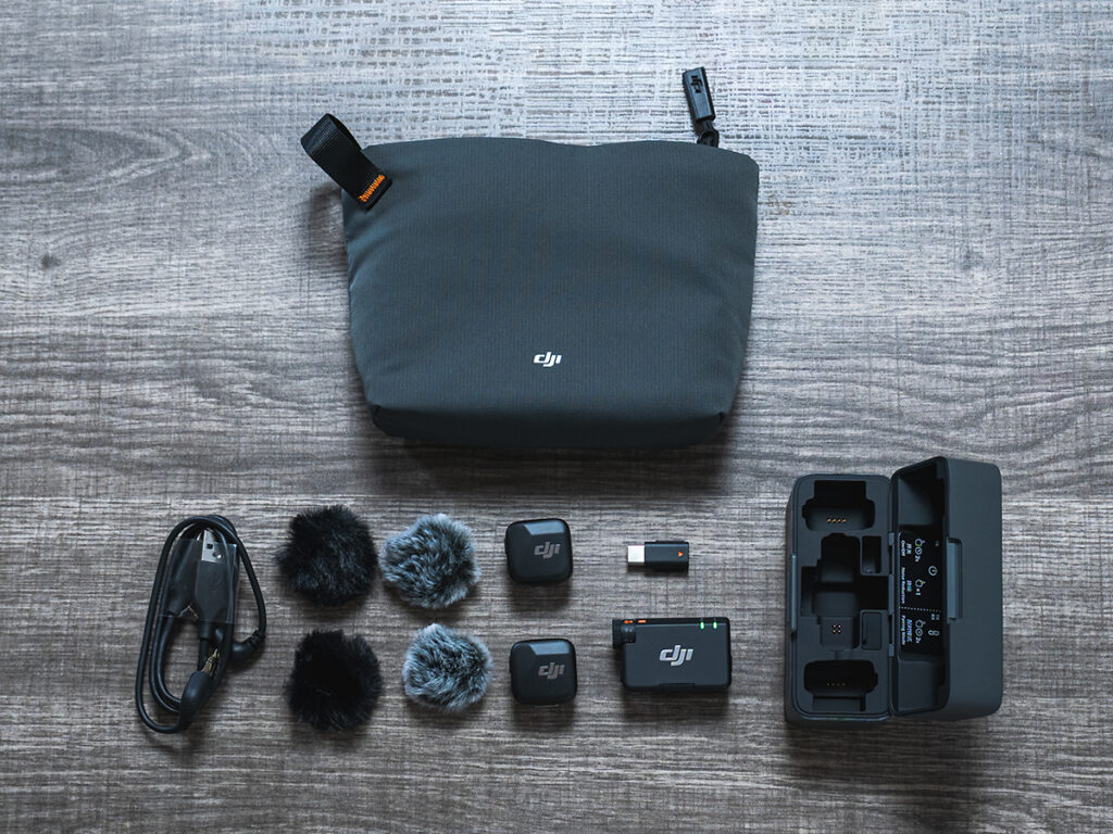 Flatlay of what comes with the DJI Mic Mini.