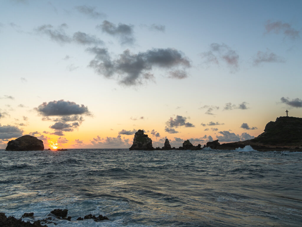 The sun peaks over the horizon at Pointe des Château in Guadeloupe.