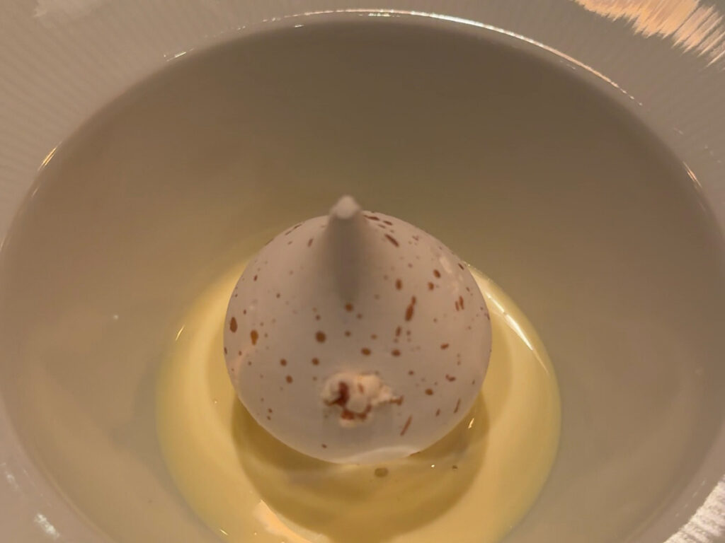 Speckled chocolate dome dessert course from the Atera NYC tasting menu