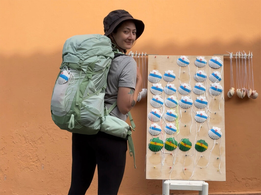 Holding up the mint green Osprey Tempest 33L backpack on the Camino Ingles.