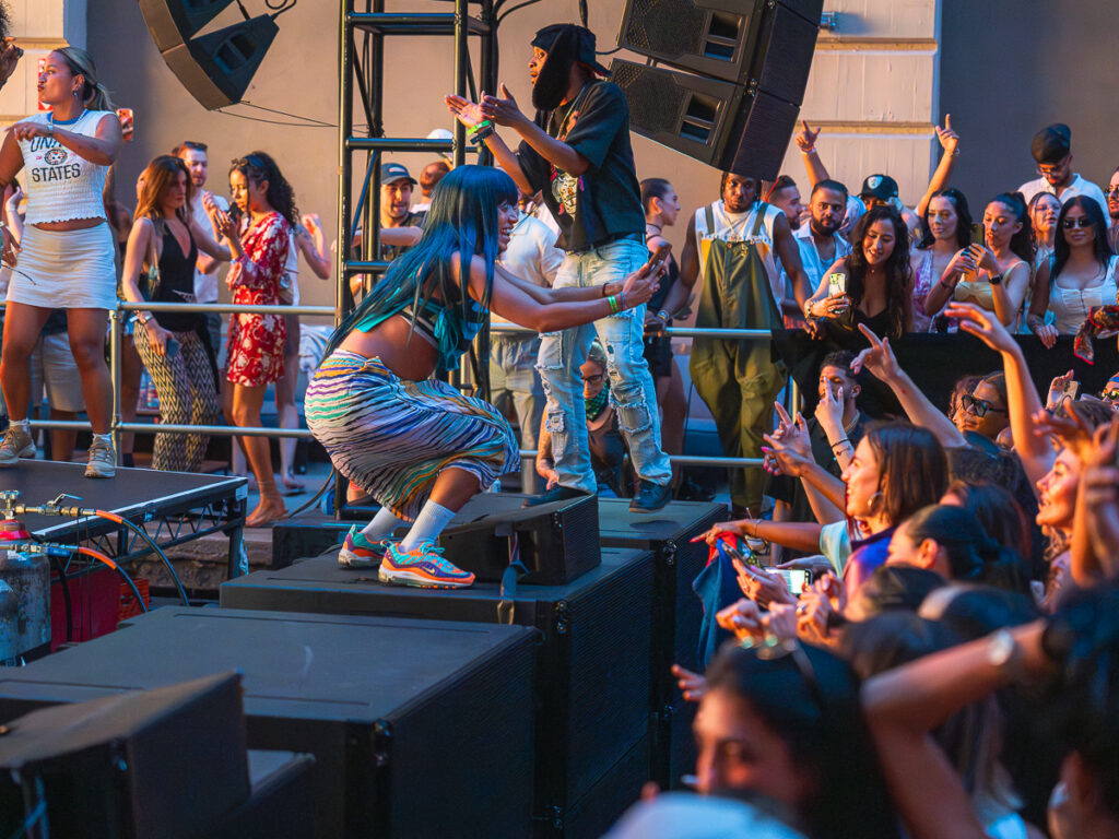 Dancer engaging the crowd at the edge of the stage at Francis Mercier Solèy Industry City Brooklyn