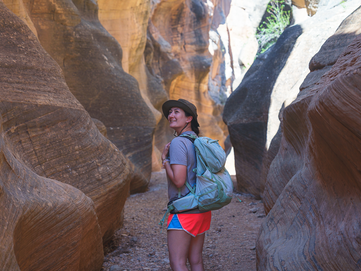 Hiking through a narrow slot canyon near Bryce Canyon, part of a 3 day Bryce Canyon itinerary.