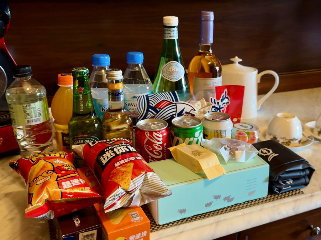Welcome basket of snacks and drinks in a guest room at Old England Manor.