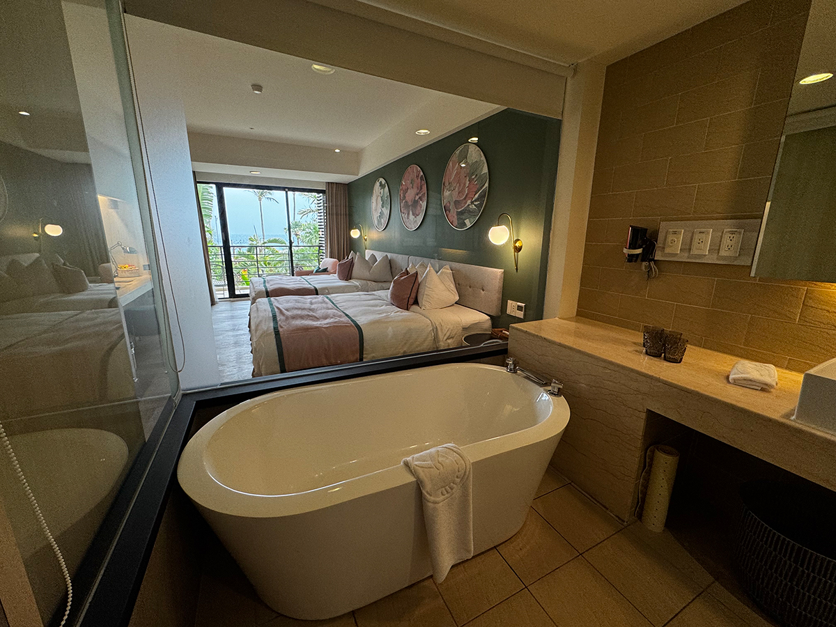 Soaking tub overlooking the bedroom at Caesar Park Hotel Kenting Taiwan.