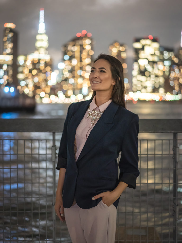 Personal branding photoshoot for Erin Donahue at Gantry Plaza State Park with the bokeh of the NYC skyline in the background.