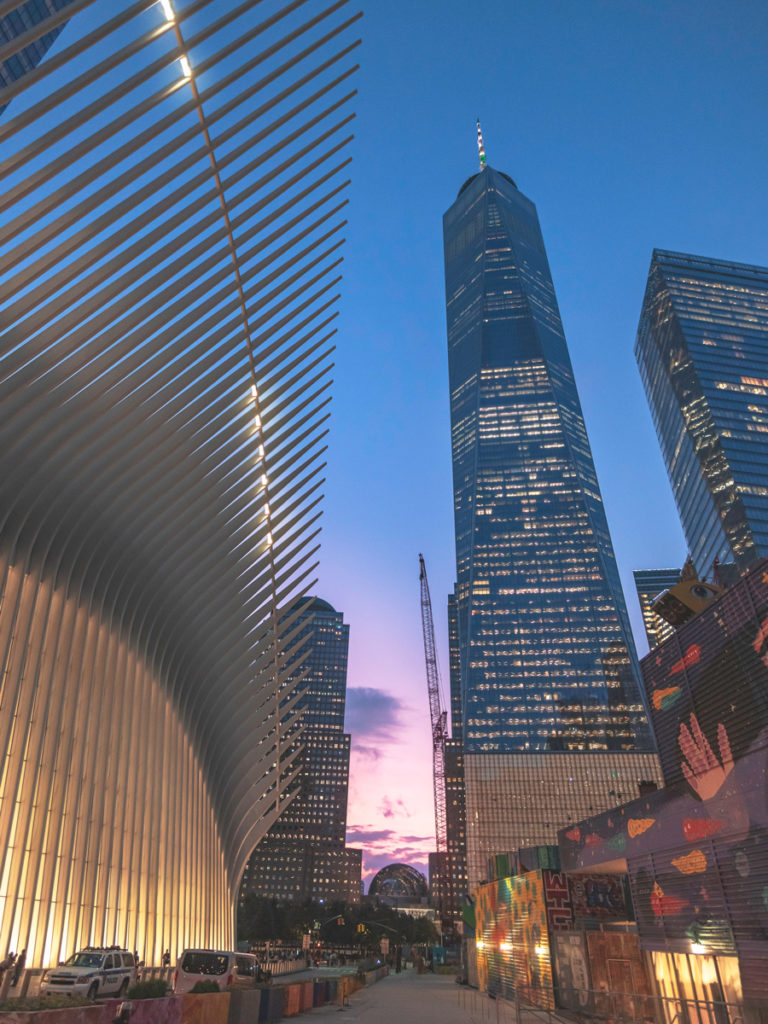 Looking up at One World Trade Center and Oculus during sunset.