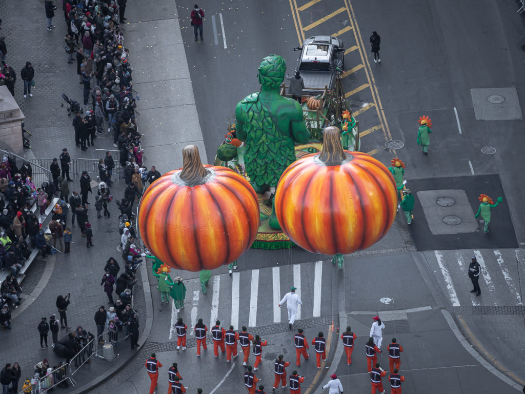 Float of the Green Giant and two pumpkins as seen from the Mandarin Oriental New York, the best hotel to watch the Thanksgiving Day Parade.