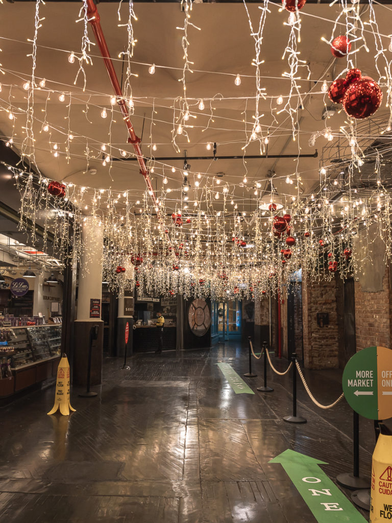 The interior of Chelsea market has pretty Christmas lights in NYC.
