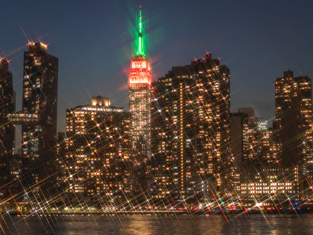 The Empire State Building colors are Christmas lights in NYC.