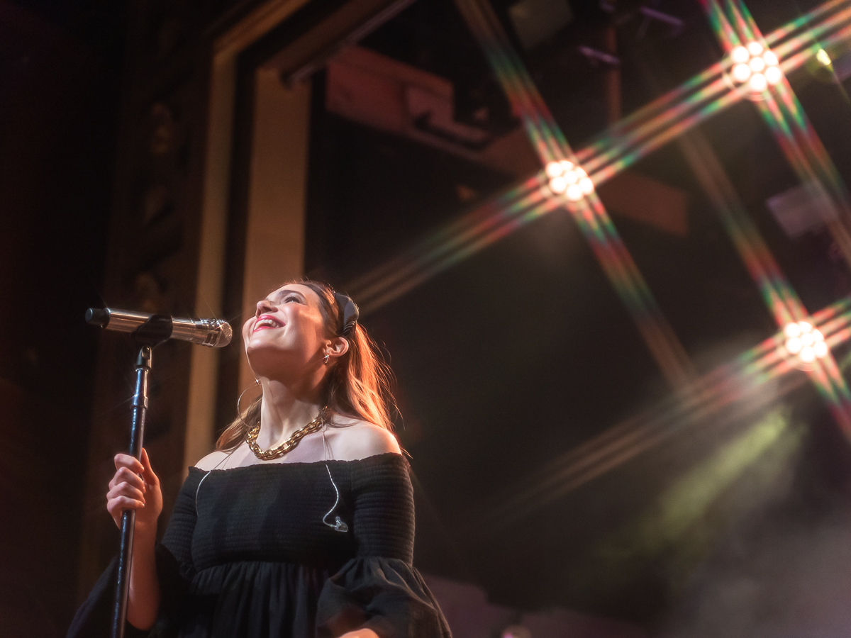 Mandy Moore smiling while singing at Webster Hall.