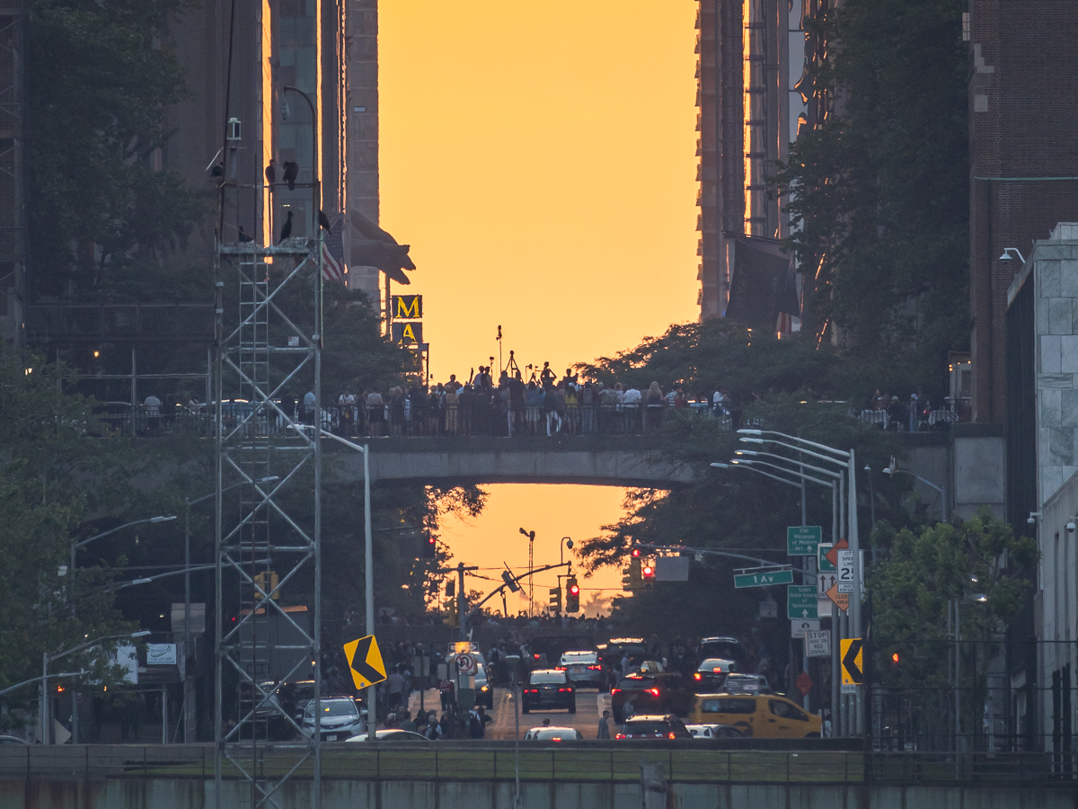 Silhouette of eager witnesses to Manhattanhenge as seen from Long Island City.