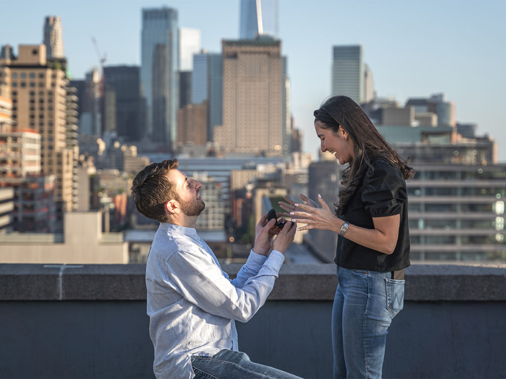 Candid moment between the couple during their West Village rooftop engagement. 