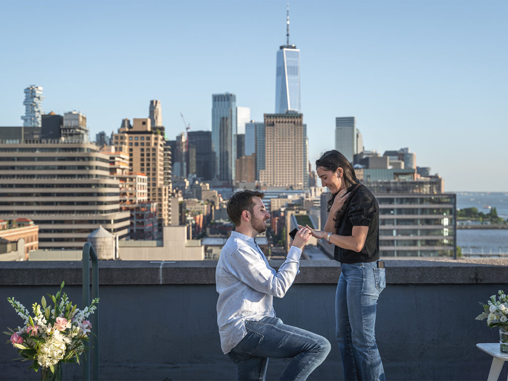 West Village rooftop engagement with the view of downtown Manhattan and the World Trade Center in the background.