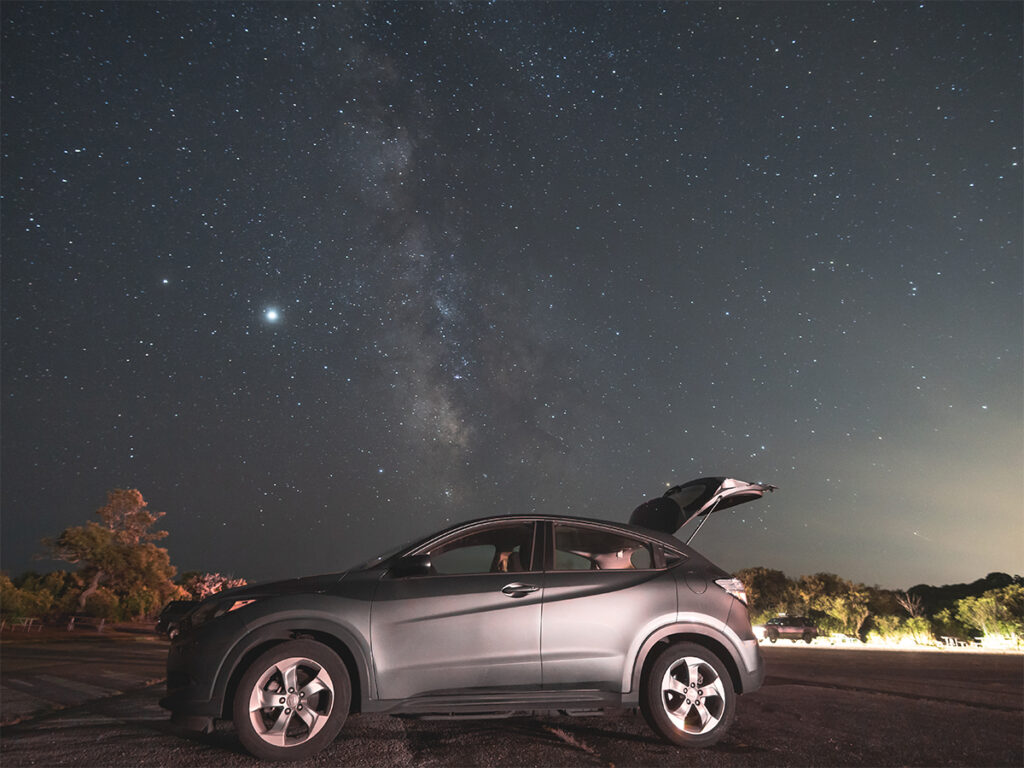 Toyota CRV with the milky way in the background.