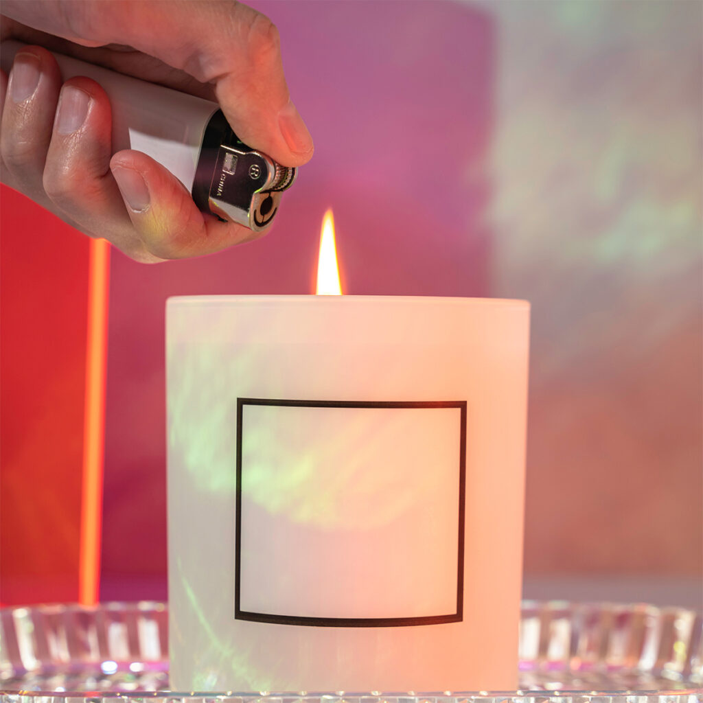 Adding a hand element to a candle home photography studio photoshoot.
