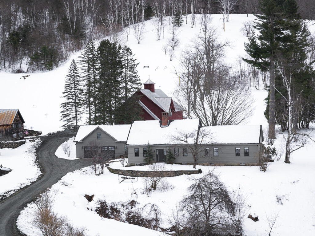 Popular Instagrammable farmhouse found in Woodstock, Vermont covered in snow.